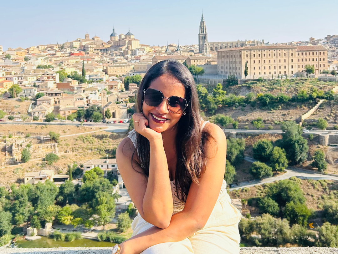 Solo female traveler enjoying panoramic view of Toledo, Spain on women-only cultural tour