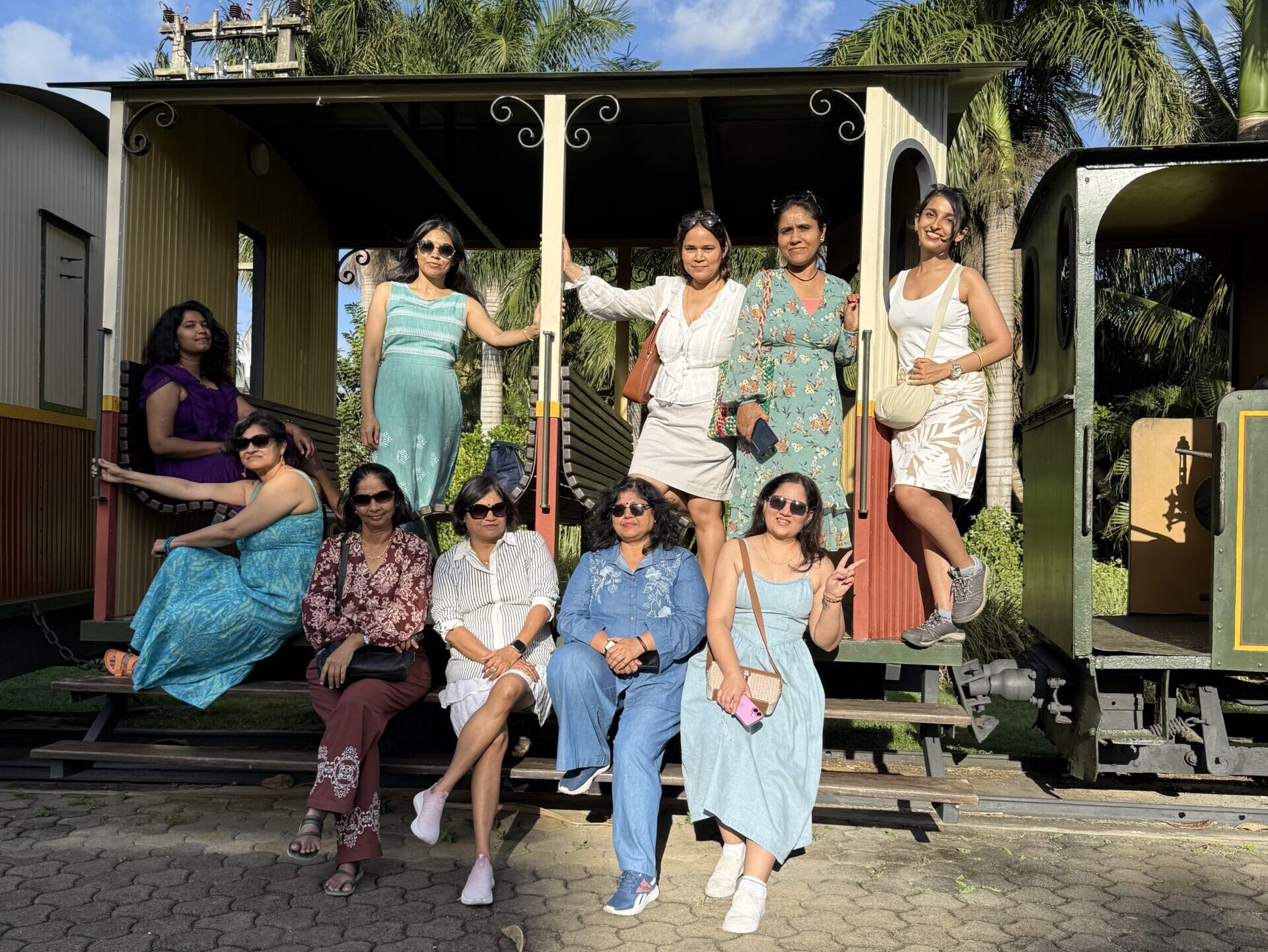 Solo women travellers pose for a group photo on a group trip to Mauritius