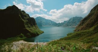 Scenic view of mountains and crater lake in the Philippines – perfect destination for women-only group trips
