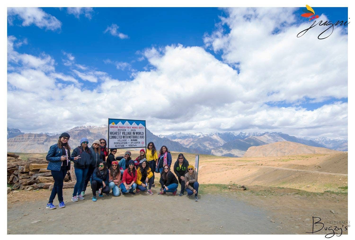 Group of solo women travellers from Jugni posing at Komic, the world’s highest motorable village in Himachal — confident, safe and empowered while exploring India.