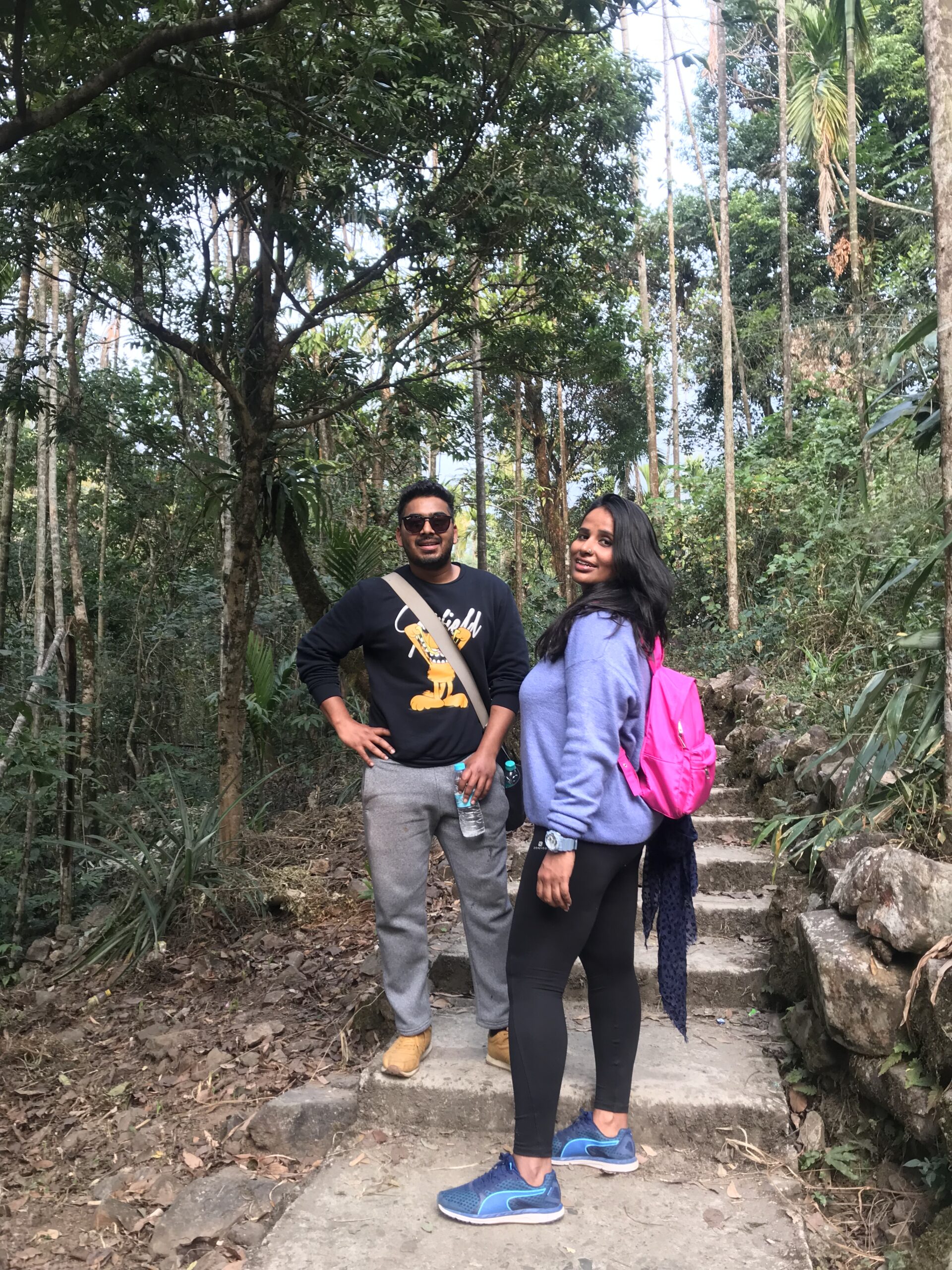 Shilpi Bisht trekking with Nitesh Chauhan, founder of Jugni Travel, at the Double Decker Root Bridge in Meghalaya during a women-only trek in India