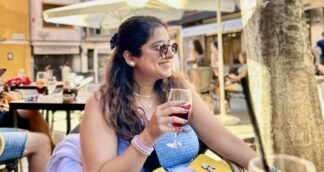 Indian woman traveller at an outdoor cafe in Croatia on a Jugni women only trip